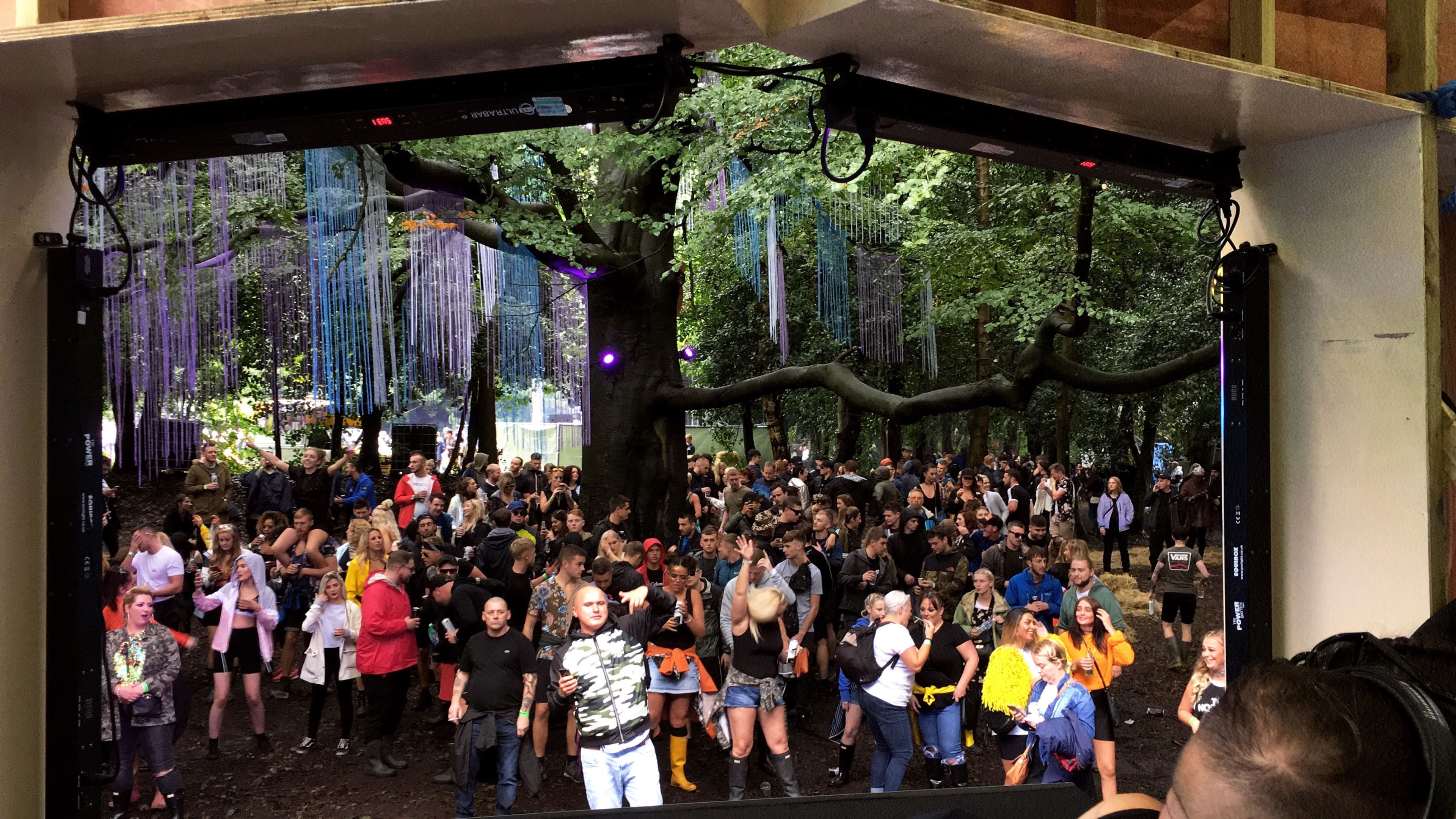 Crowd gathered at an outdoor Grenade event among trees, 2015